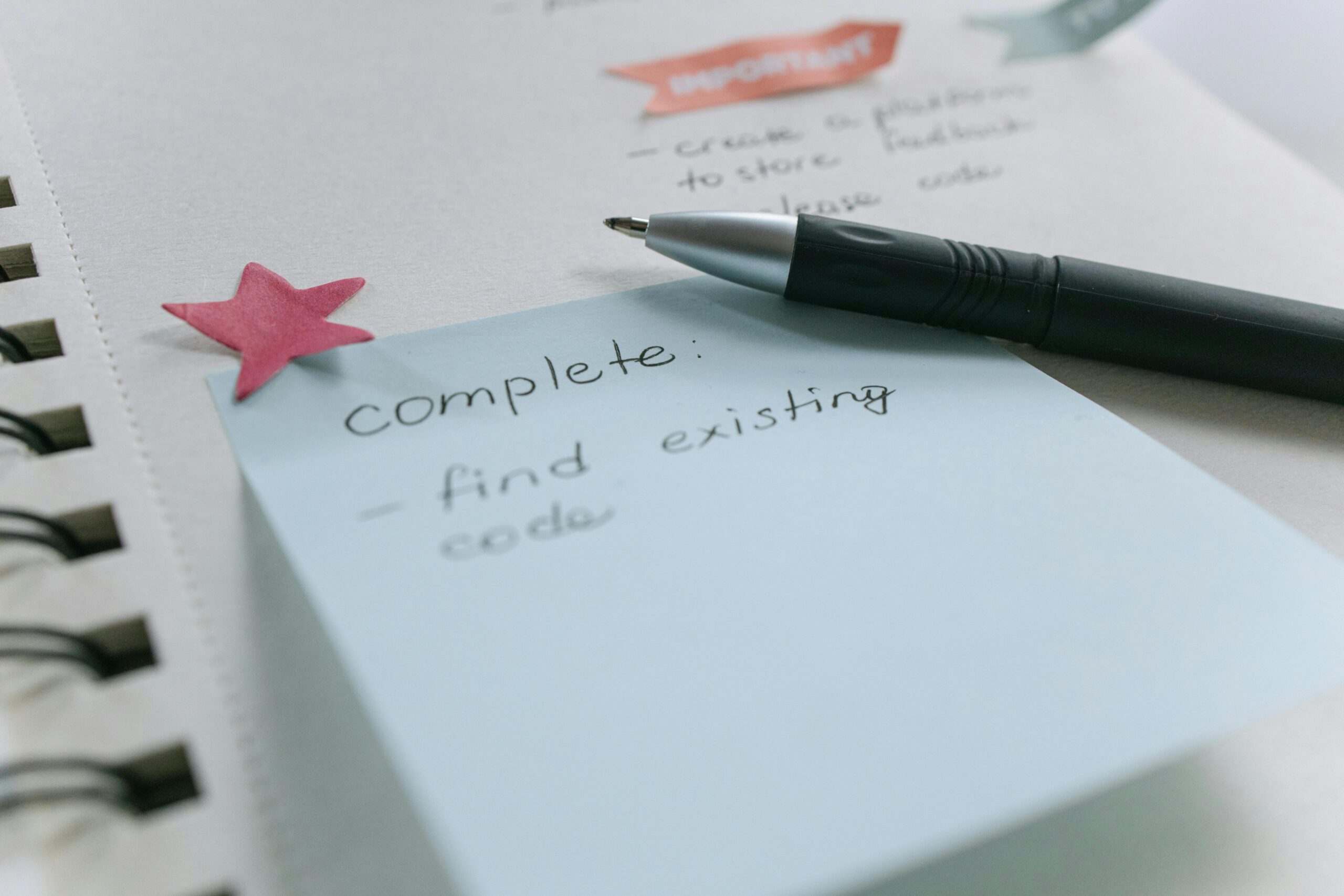 Overwhelming handwritten to-do list spilled across a desk