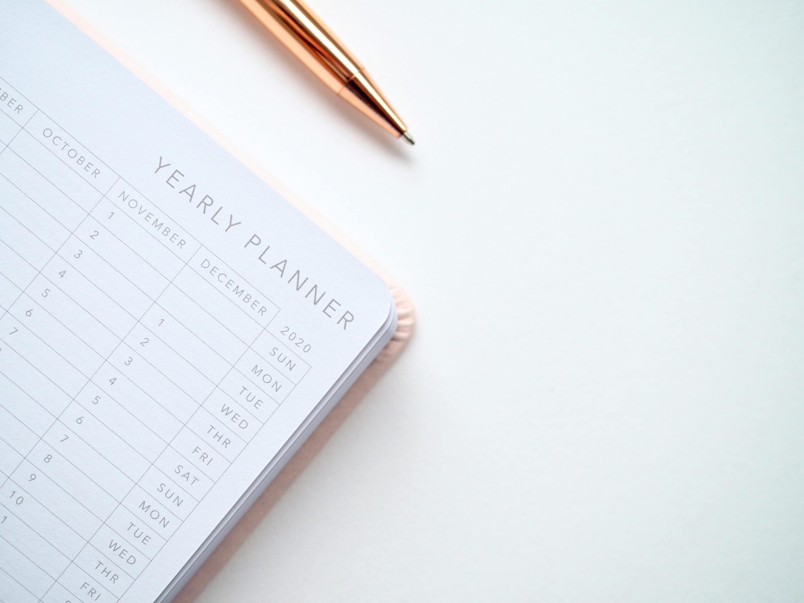 Sarah’s customized Day Designer page featuring habit tracker and colorful calligraphy headers.